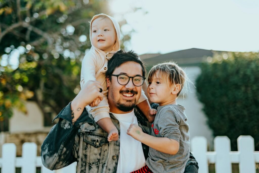 Happy father spending time with his two children